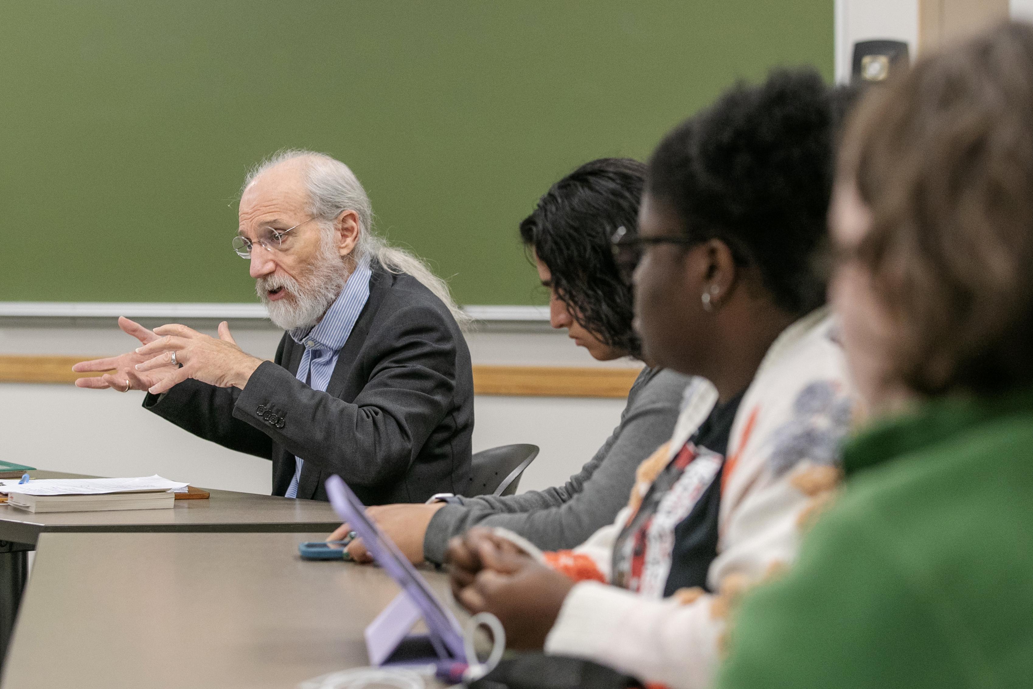 Professor+Michael+Marx+gestures+enthusiastically+as+his+Scribner+Seminar+students+watch.